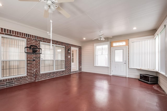 interior space with ceiling fan and covered porch