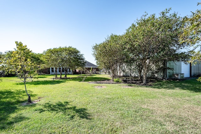 view of yard featuring central AC