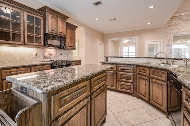 kitchen featuring backsplash, black appliances, sink, light tile patterned floors, and ornamental molding