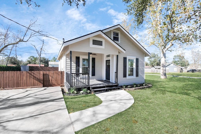 bungalow-style home with a porch and a front yard