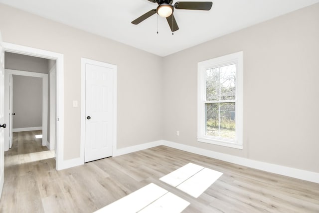 spare room with ceiling fan and light hardwood / wood-style floors