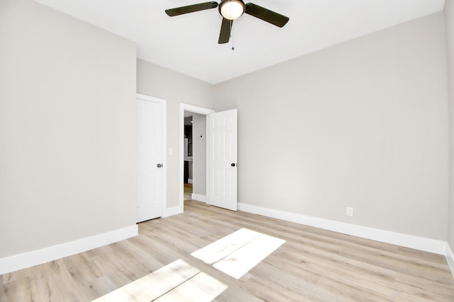 unfurnished room featuring light wood-type flooring and ceiling fan