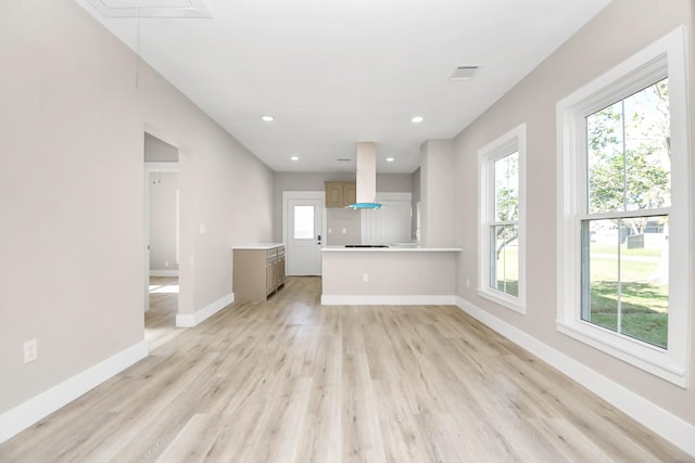 unfurnished living room featuring light hardwood / wood-style floors