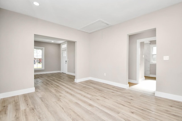 spare room with light wood-type flooring