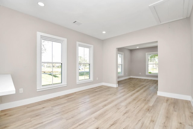 spare room with light wood-type flooring