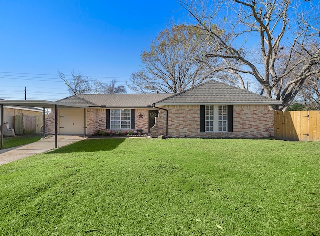 ranch-style house featuring a front yard, a garage, and a carport