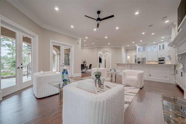 living room featuring a ceiling fan, recessed lighting, french doors, and ornamental molding