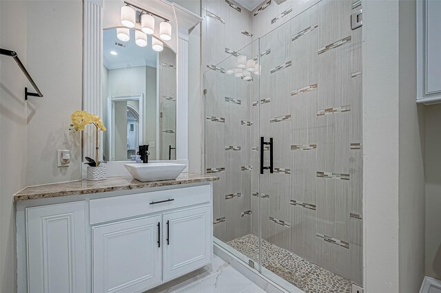 bathroom with an enclosed shower and vanity