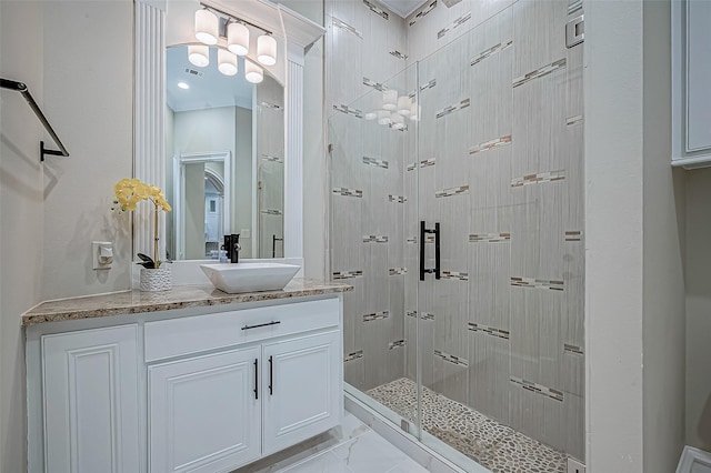 bathroom featuring vanity, visible vents, a stall shower, and marble finish floor