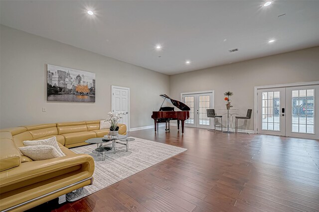 living room with french doors and hardwood / wood-style floors