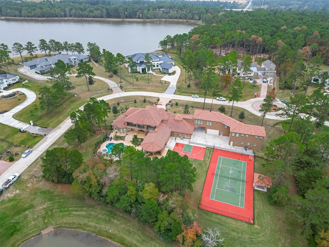 bird's eye view featuring a view of trees and a water view