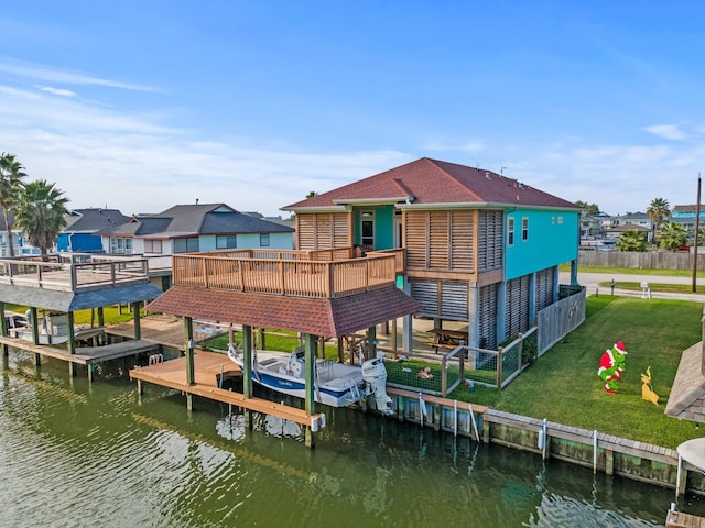 view of dock with a lawn and a deck with water view