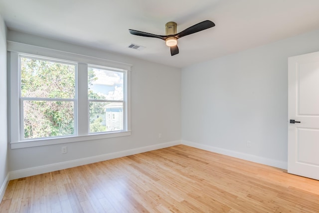 spare room featuring ceiling fan and light wood-type flooring