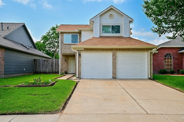 view of front facade featuring a front yard and a garage