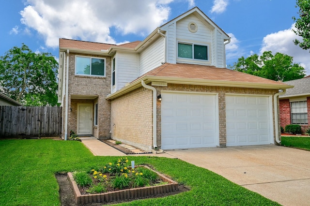 view of front of house with a garage and a front lawn