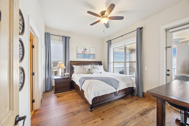 bedroom with light wood-type flooring and ceiling fan