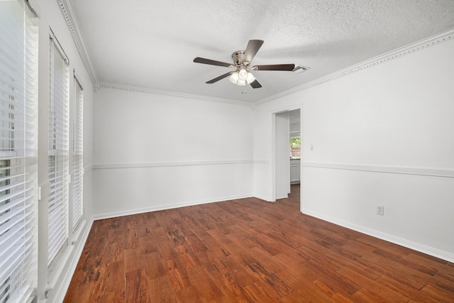 unfurnished bedroom with ornamental molding, a textured ceiling, ceiling fan, and dark wood-type flooring