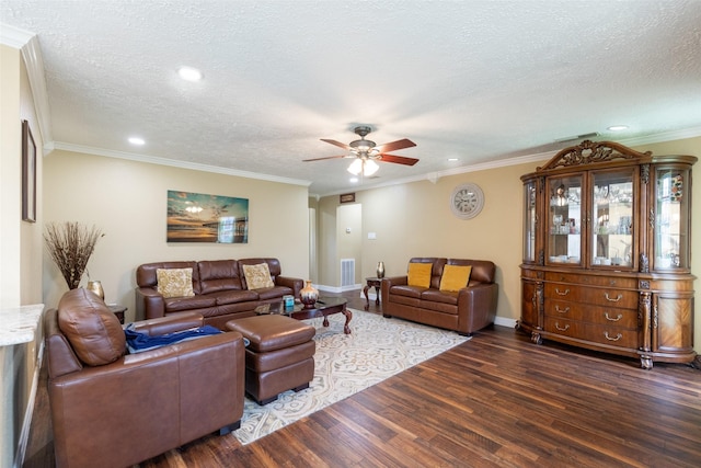 living room featuring a textured ceiling, dark hardwood / wood-style floors, and ornamental molding