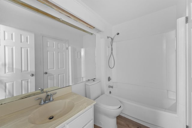 full bathroom with shower / washtub combination, toilet, wood-type flooring, and vanity