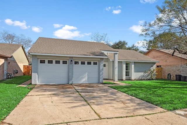 view of front of house with a front lawn and a garage