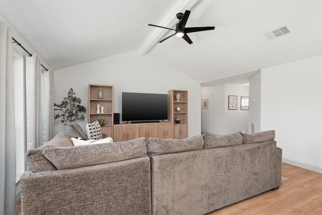 living room featuring lofted ceiling with beams, hardwood / wood-style flooring, and ceiling fan