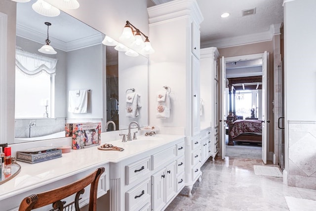 bathroom featuring ornamental molding and vanity