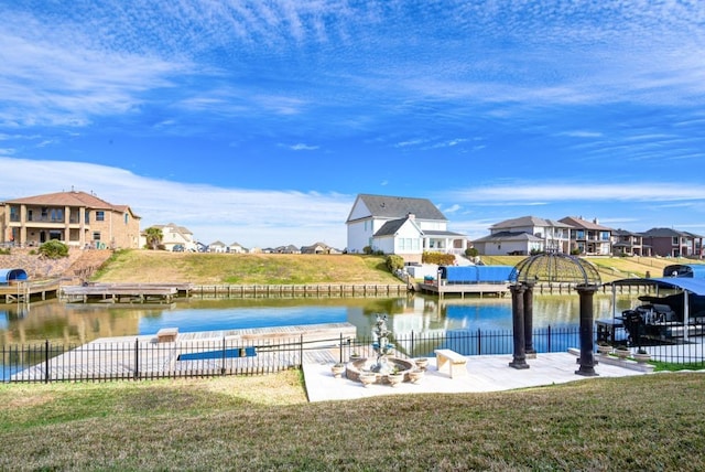 exterior space with an outdoor fire pit and a boat dock