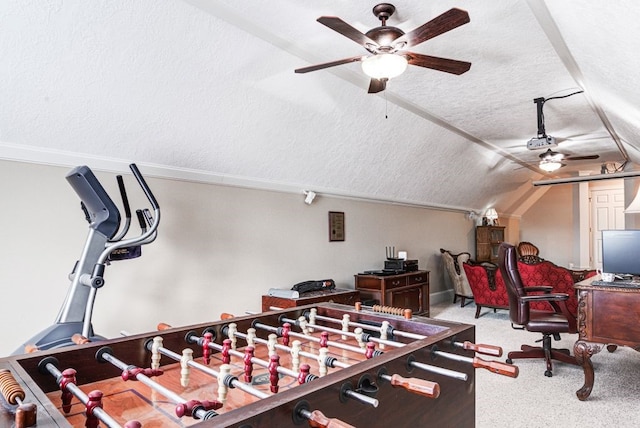 rec room featuring vaulted ceiling, ceiling fan, light colored carpet, and a textured ceiling