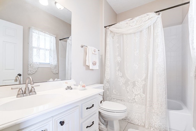 full bathroom with a textured ceiling, tile patterned floors, vanity, toilet, and shower / bath combo with shower curtain