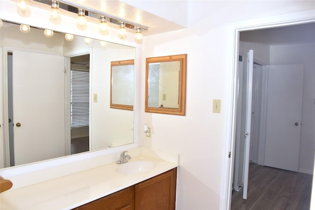 bathroom featuring hardwood / wood-style floors and vanity