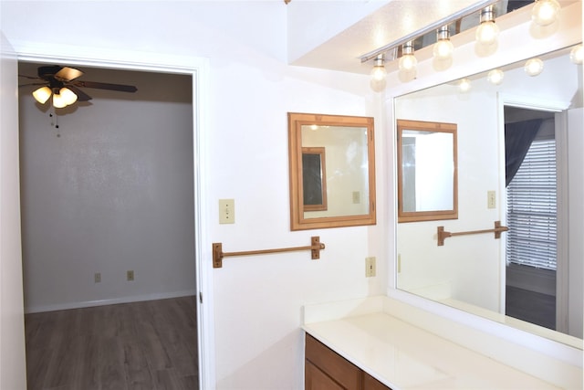 bathroom featuring ceiling fan and wood-type flooring