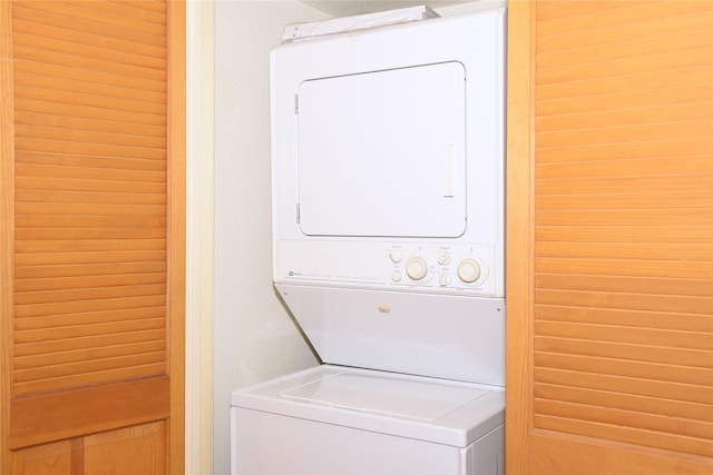 laundry room featuring stacked washer and clothes dryer