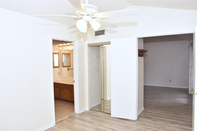 spare room featuring ceiling fan and light wood-type flooring