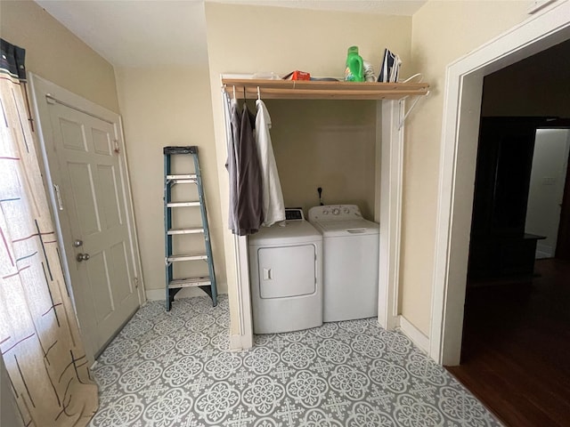 washroom featuring washer and clothes dryer