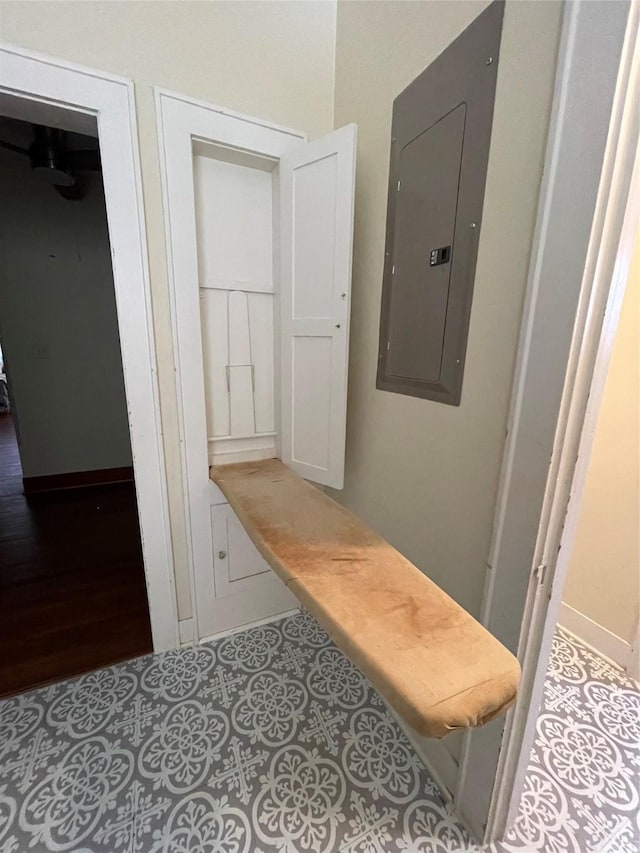 mudroom with tile patterned floors and electric panel