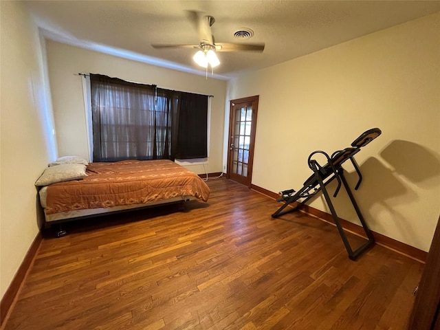 bedroom with ceiling fan and wood-type flooring