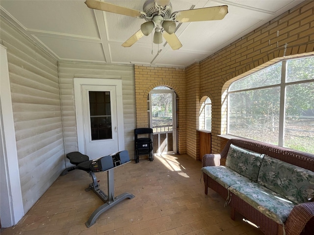 sunroom / solarium with ceiling fan