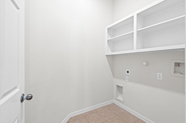 washroom with electric dryer hookup, gas dryer hookup, light tile patterned floors, and washer hookup