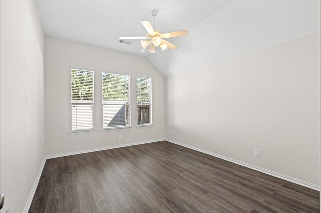 spare room with dark hardwood / wood-style floors, ceiling fan, and lofted ceiling