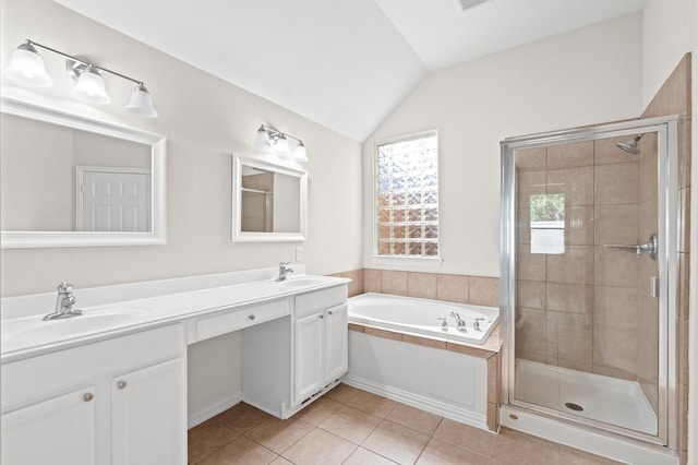 bathroom featuring tile patterned floors, vanity, shower with separate bathtub, and vaulted ceiling