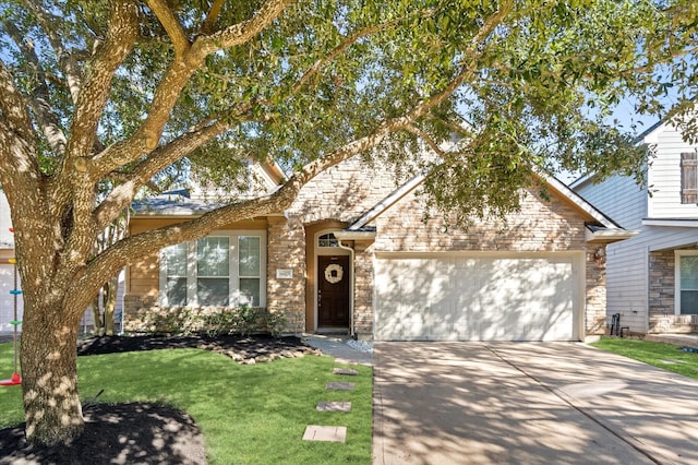 view of front of home with a front yard and a garage