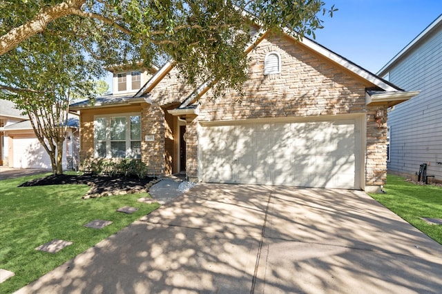 view of front of property featuring a garage and a front yard