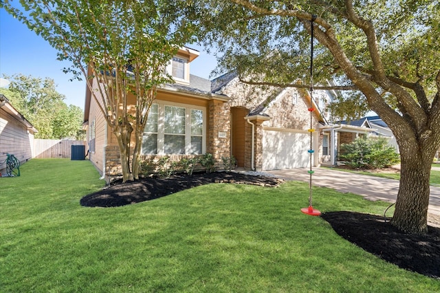 view of front of home with central AC, a front lawn, and a garage