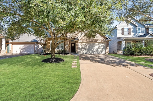 view of front of home with a garage and a front lawn