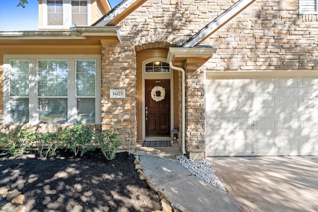 property entrance with a garage