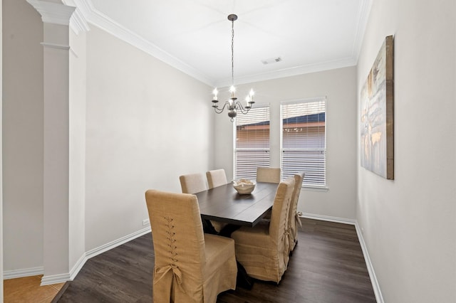 dining area featuring dark wood-type flooring, crown molding, and a chandelier