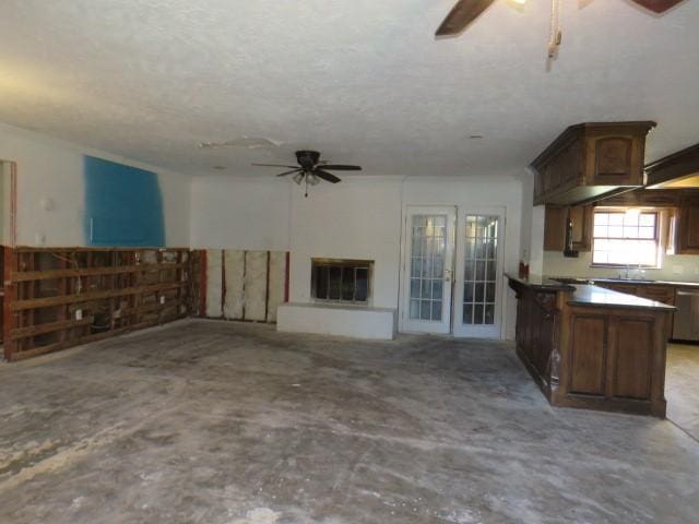 interior space with ceiling fan and sink