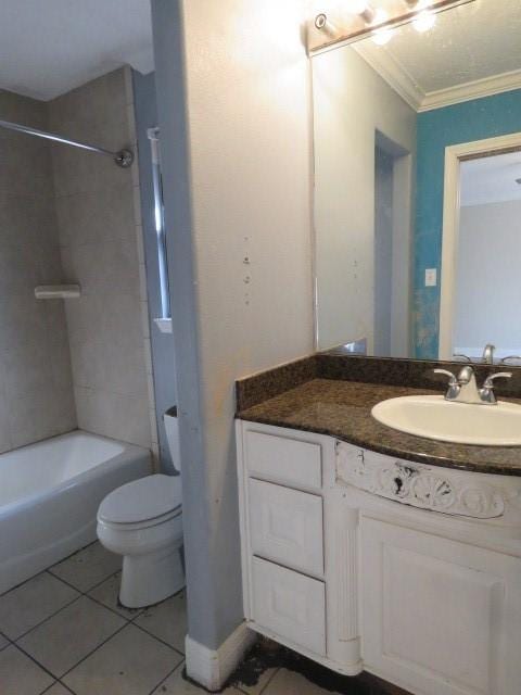 full bathroom featuring ornamental molding, tile patterned floors, toilet, vanity, and tiled shower / bath