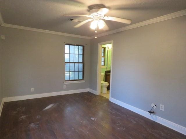 unfurnished room with ceiling fan, dark hardwood / wood-style flooring, and crown molding