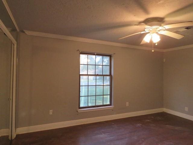 unfurnished room featuring crown molding and ceiling fan